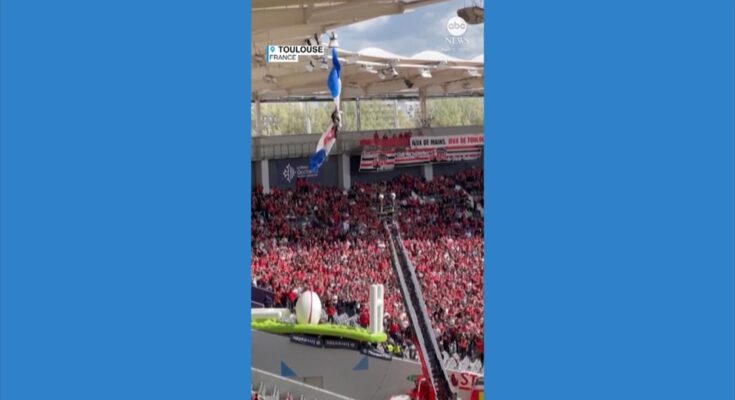 WATCH: Parachutist rescued after getting caught on stadium roof WATCH: Parachutist rescued after getting caught on stadium roof